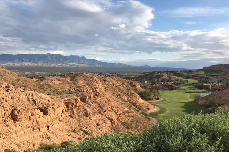 view of rock arches by golf course green